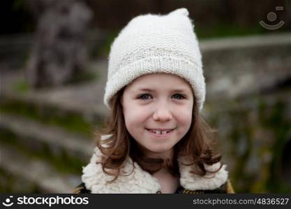 Beautiful girl with wool hat at winter in the street