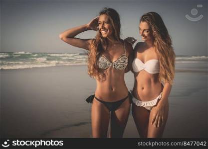 Beautiful girls in a summer day having fun on the beach