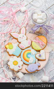 Beautiful glazed Easter cookies on wooden table. Beautiful glazed Easter cookies