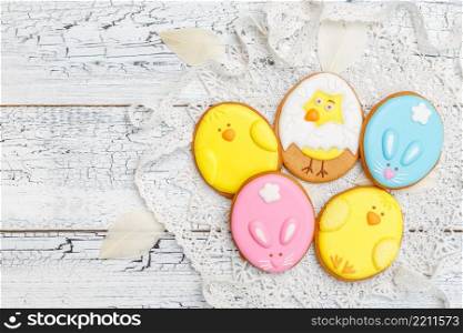 Beautiful glazed Easter cookies on wooden table. Beautiful glazed Easter cookies