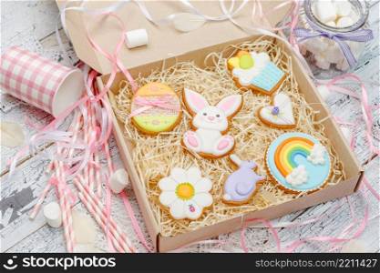 Beautiful glazed Easter cookies on wooden table - eggs and bunny close-up. Beautiful glazed Easter cookies