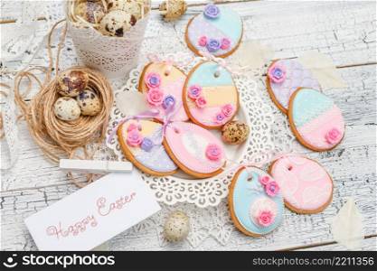 Beautiful glazed Easter cookies on wooden table - eggs close-up. Beautiful glazed Easter cookies