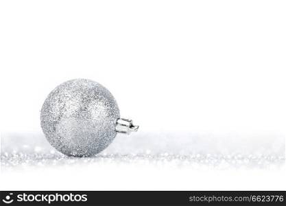 Beautiful Glitter christmas ball close-up on shining background