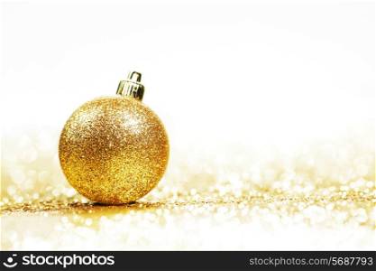 Beautiful Glitter christmas ball close-up on shining background with white copy space
