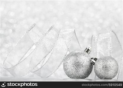 Beautiful Glitter christmas balls close-up on shining background