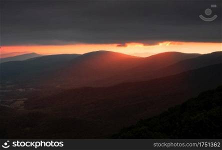 Beautiful glow from the sun shining warm light over the ridges of Shenandoah National Park in the morning.