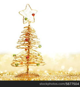 Beautiful golden decorative christmas tree on golden glitter background with white copy space