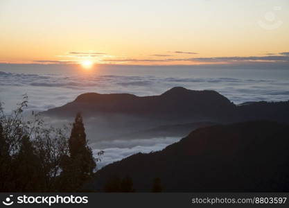 Beautiful golden sunset with dramatic cloud formation with mounatins in Alishan National Park Taiwan