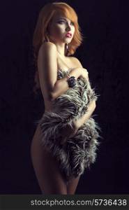 Beautiful, gorgeous, ginger girl cover her nude body with fluffy fur. She has got amazing bracelet and earrings.