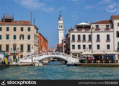 Beautiful Grand Canal in Venice. Gorgeous bridge and tower on background. Italy.. Venice canal scene in Italy