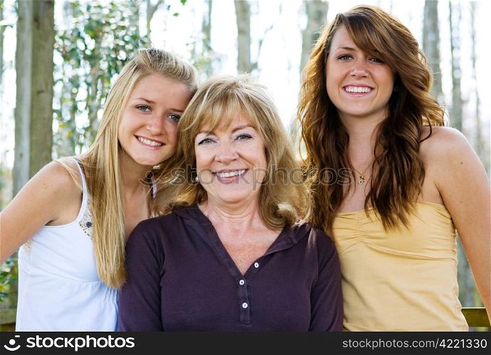 Beautiful grandmother with her lovely teen granddaughters.
