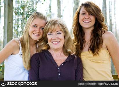 Beautiful grandmother with her lovely teen granddaughters.