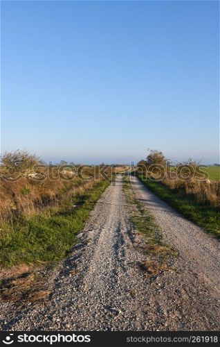 Beautiful gravel road in the countryside at the swedish island Oland