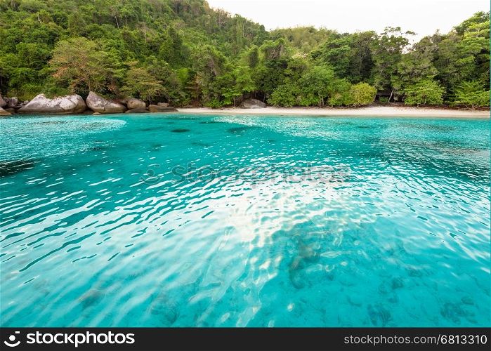 Beautiful green blue sea front small beach at Honeymoon Bay is a famous attractions for diving on Ko Miang island in Mu Koh Similan National Park, Phang Nga Province, Thailand