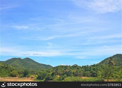 beautiful green mountains and blue sky on background