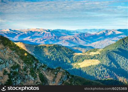 Beautiful green mountains and hills over blue sky