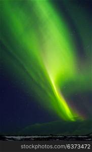 Beautiful green Northern light in the starry sky, natural phenomenon, Aurora Australis, wonderful nature of Iceland
