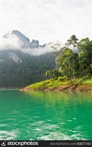 Beautiful green river and mountains in Ratchaprapha Dam, Khao Sok National Park, Surat Thani Province, Thailand&#xA;