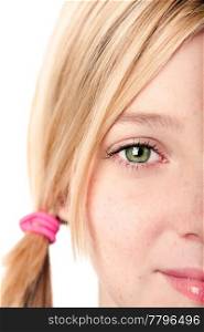 Beautiful green watchful eye of a teenage girl with blond hair pigtail, isolated.
