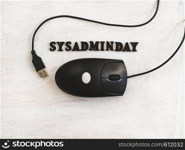 Beautiful greeting card for Sysadmin Day. Wooden letters with a congratulatory inscription on a white background. Close-up, top view. Congratulations for loved ones, friends and colleagues. Greeting card for Sysadmin Day. White background