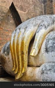 Beautiful hand of big buddha in Sukhothai Historic Park, Thailand