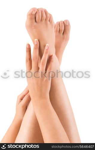Beautiful hands on legs over white background