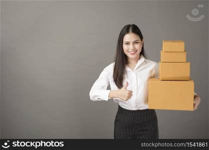Beautiful happiness woman with box portrait in studio