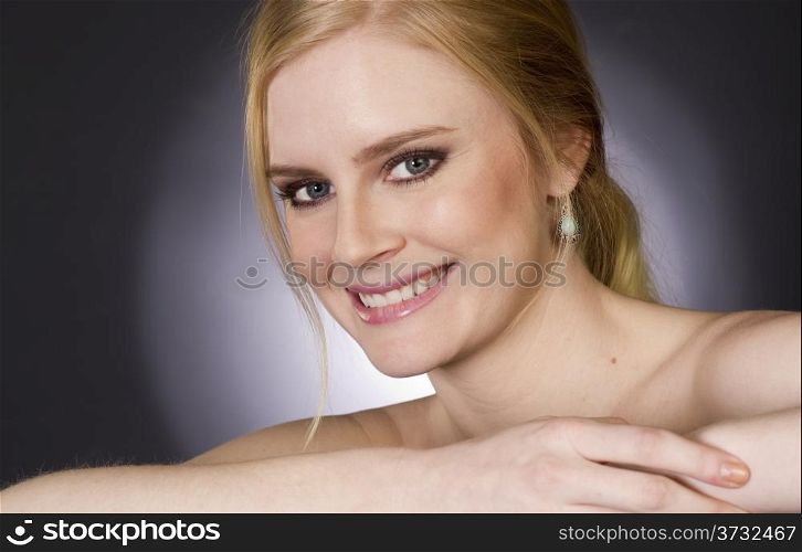 Beautiful Happy Blond Woman Smiling Big in Head and Shoulders Beauty Pose