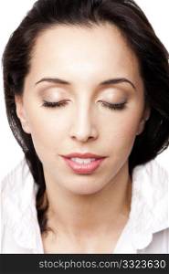 Beautiful happy Caucasian Hispanic Woman face with eyes closed. Clean and smooth clear facial skin of a female after a spa treatment, isolated.