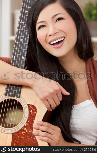 Beautiful Happy Chinese Oriental Asian Woman Smiling & Guitar