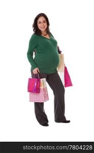 Beautiful happy exciting smiling Caucasian pregnant brunette woman holding shopping bags while standing, isolated