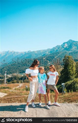 Beautiful happy family in mountains with amazing landscape. Beautiful happy family in mountains in the background of fog. Beautful landscape