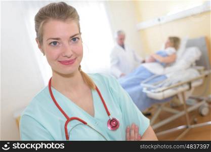 beautiful happy female doctor standing in the hospital