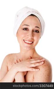 Beautiful happy healthy radiant woman female face with towel around head finished bath shower spa treatment touching her shoulder skin with freckles, isolated.