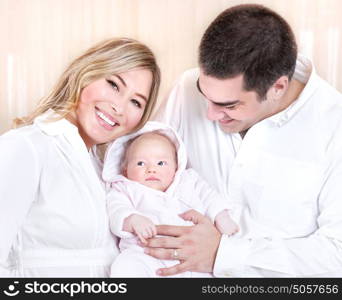 Beautiful happy mother and father carrying adorable sweet little daughter at home, conception of baby birth, new life, love concept