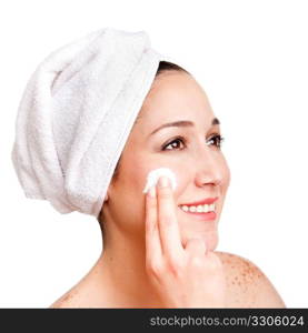 Beautiful happy smiling woman face applying exfoliating cream as anti-aging skincare treatment at spa, isolated.