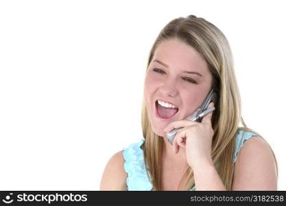 Beautiful happy teen girl talking on cellphone.