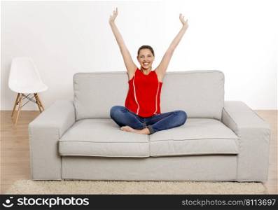 Beautiful happy woman having a good time at home