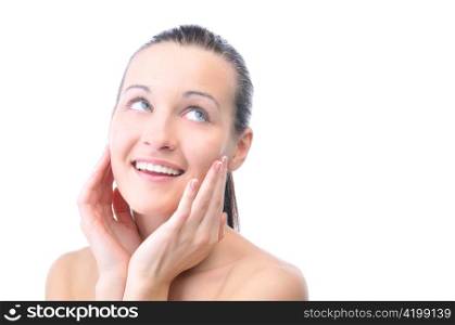 beautiful happy woman is looking sideways and touching her face