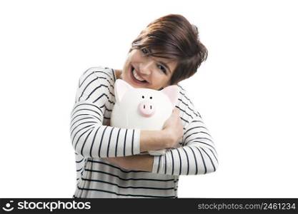 Beautiful happy woman with a piggybank, isolated over a white background. Woman with a piggybank