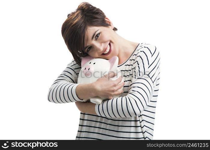 Beautiful happy woman with a piggybank, isolated over a white background. Woman with a piggybank