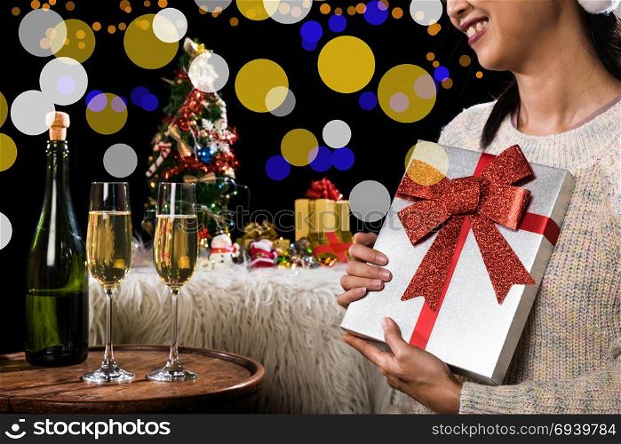 Beautiful happy woman with gift box at celebration party, bachelorette party, birthday and holidays concept
