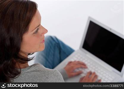 Beautiful happy woman with laptop on white background
