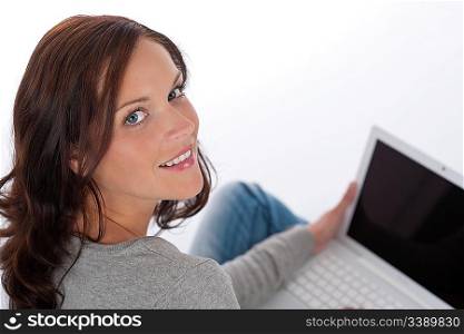 Beautiful happy woman with laptop on white background