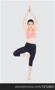 Beautiful happy young asian woman doing yoga exercise sport for leisure and relax isolated on white background, asia girl standing workout with stretch muscle arm for healthy and wellbeing.