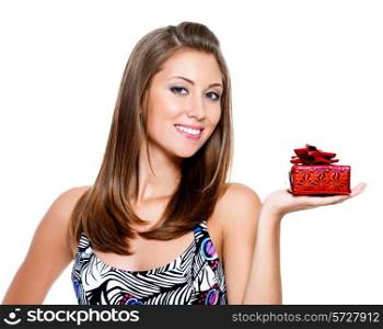 Beautiful happy young woman holding the present on white background