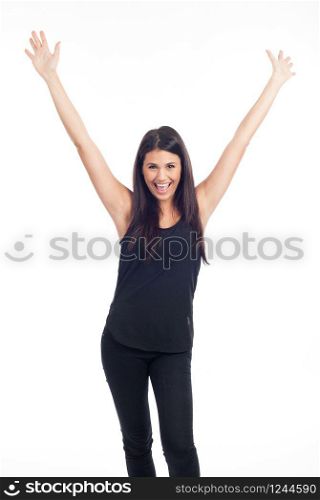 beautiful happy young woman in black dress and hands in the air