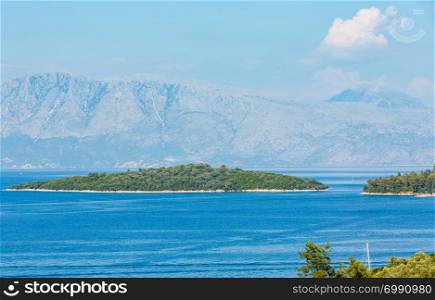 Beautiful hazy summer Lefkada coastline landscape (Nydri, Greece, Ionian Sea).