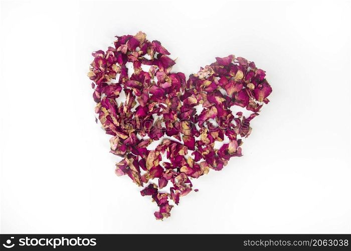 beautiful heart of dried red rose petals isolated on white background, copy space, Valentines Day romantic concept space for text. beautiful heart of dried red rose petals isolated on white background, copy space, Valentines Day romantic concept