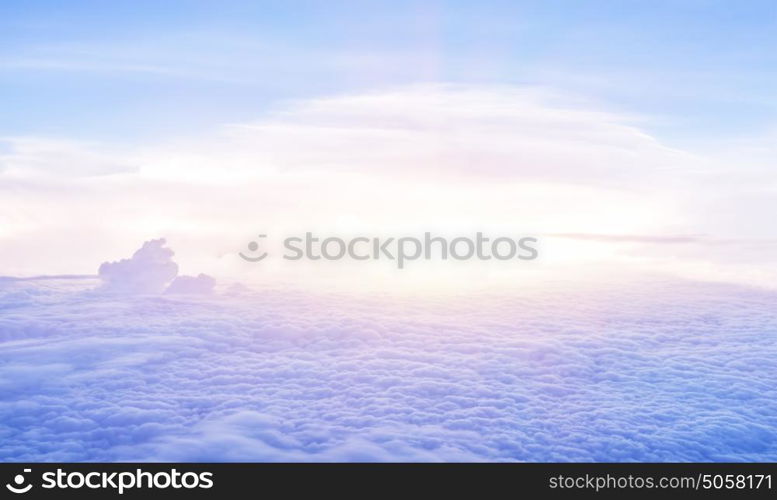 Beautiful heaven in the morning, flying over fluffy clouds, bright sun light, peaceful landscape, good weather, freedom concept